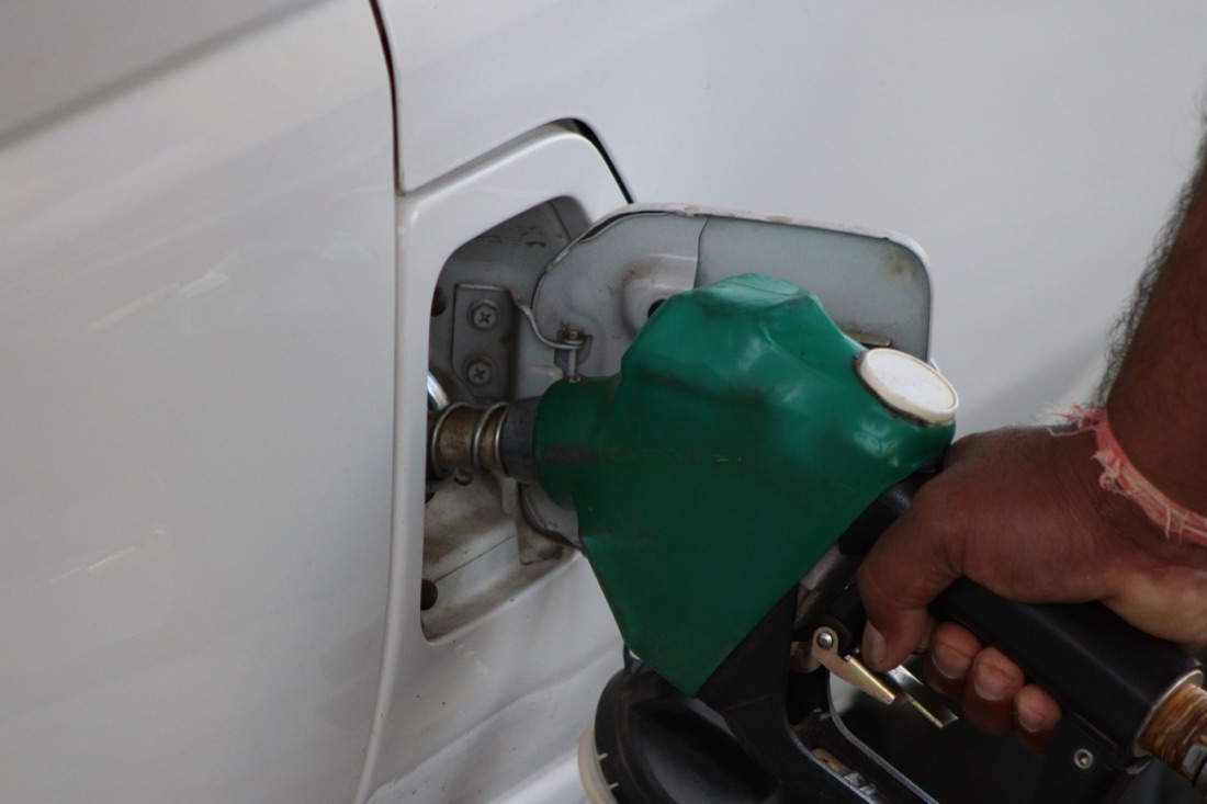 A vehicle refueling at a C-store forecourt
